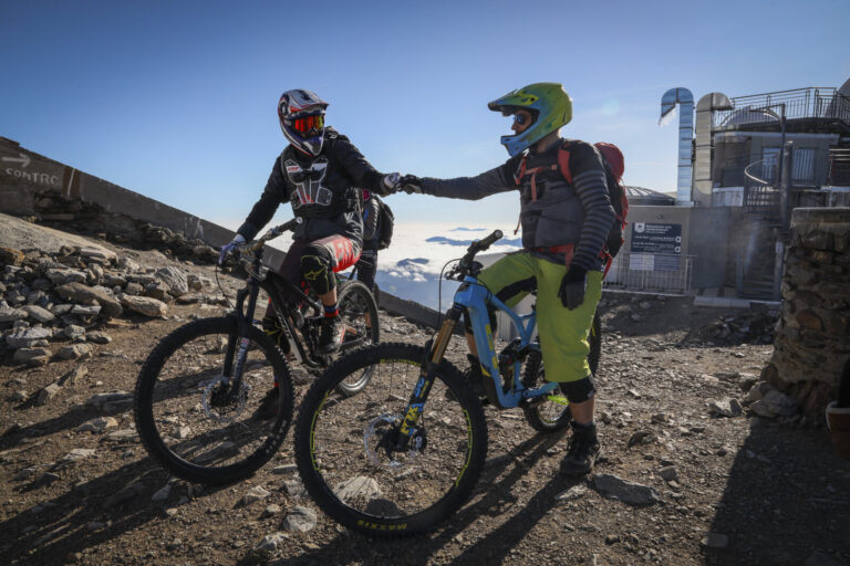 France, Bagneres-de-Bigorre, 2019-09-28. Alexis Righetti rides the highest ridges of the Pyrenees, carrying his bike whe