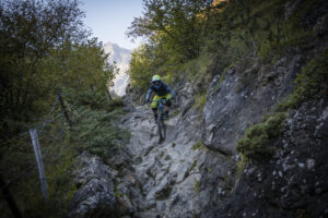 France, Bagneres-de-Bigorre, 2019-09-28. Alexis Righetti rides the highest ridges of the Pyrenees, carrying his bike whe