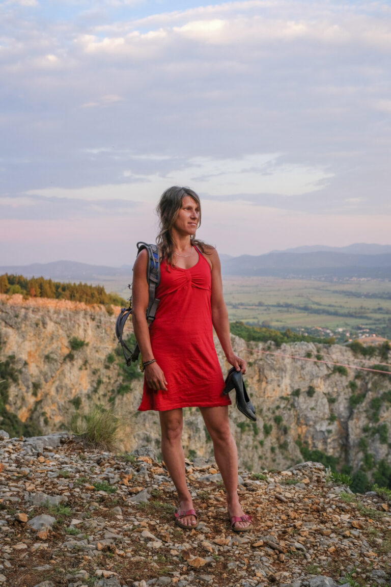 Croatia, Imotski, 2018-05-10. Above the Red Lake, a collapsed karst sinkhole near Imotski, a team rigs highlines and jum