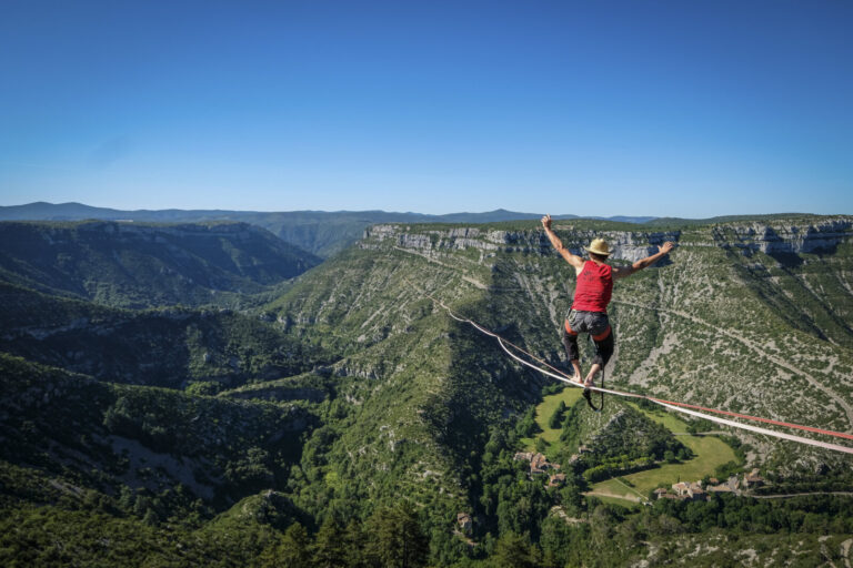 France, Navacelles, 2017-06-08. In the Cirque de Navacelles a 1662 metre highline is rigged from one rim of the canyon t