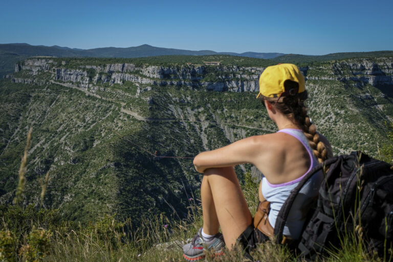 France, Navacelles, 2017-06-08. In the Cirque de Navacelles a 1662 metre highline is rigged from one rim of the canyon t