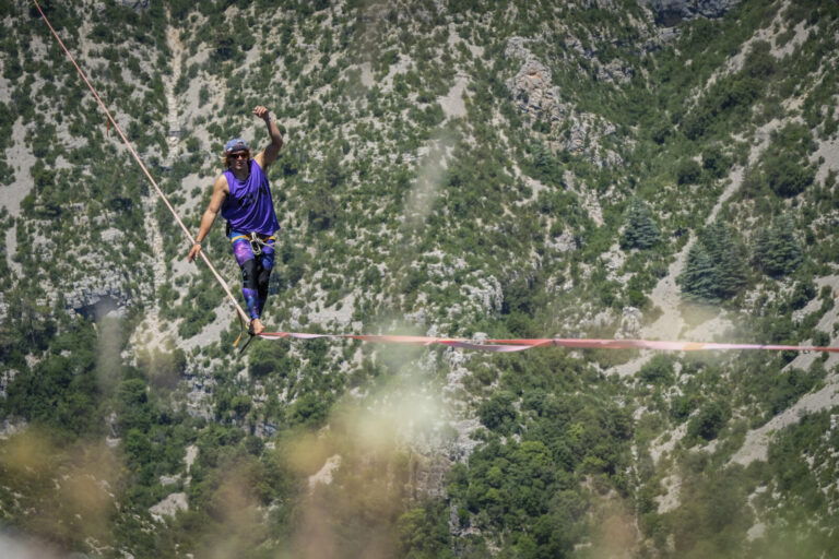 France, Navacelles, 2017-06-08. In the Cirque de Navacelles a 1662 metre highline is rigged from one rim of the canyon t