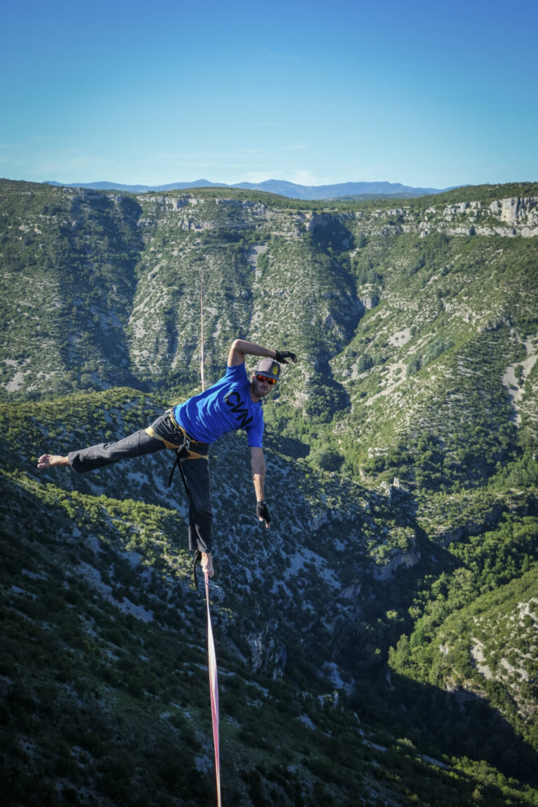 France, Navacelles, 2017-06-08. In the Cirque de Navacelles a 1662 metre highline is rigged from one rim of the canyon t