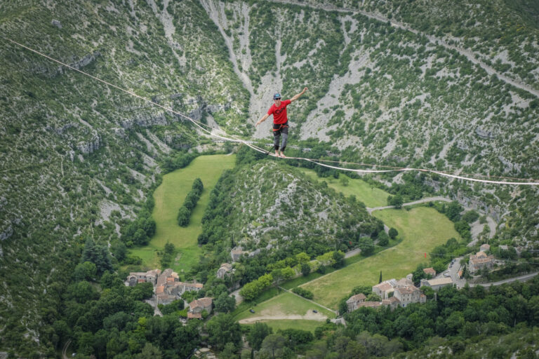 France, Navacelles, 2017-06-09. In the Cirque de Navacelles a 1662 metre highline is rigged from one rim of the canyon t