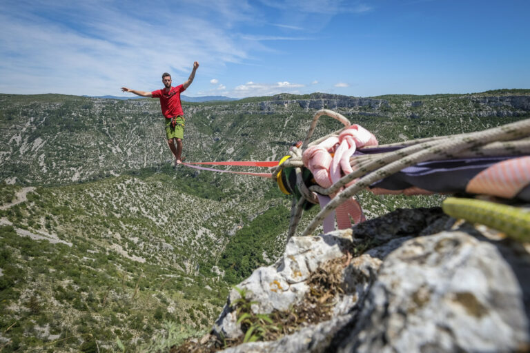 France, Navacelles, 2017-06-09. In the Cirque de Navacelles a 1662 metre highline is rigged from one rim of the canyon t