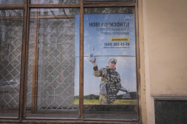 Ukraine, Kyiv, 2026-04-19. Ordinary life in the centre of Kyiv in April 2026, where army recruiting posters share the bo