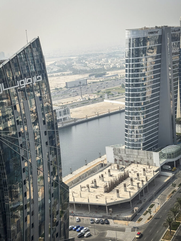 United Arab Emirates, Dubai, 2023-10-21. In the Business Bay district, towers rise along the Dubai Water Canal within si