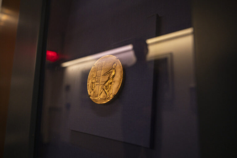 United States, New York, 2026-08-07. The gold medal of the Pulitzer Prize in its display case at the journalism school. 