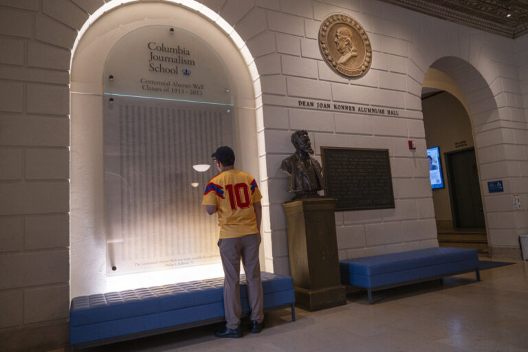 United States, New York, 2026-08-07. A visitor reads the names engraved on the Centennial Alumni Wall of the school. Pho