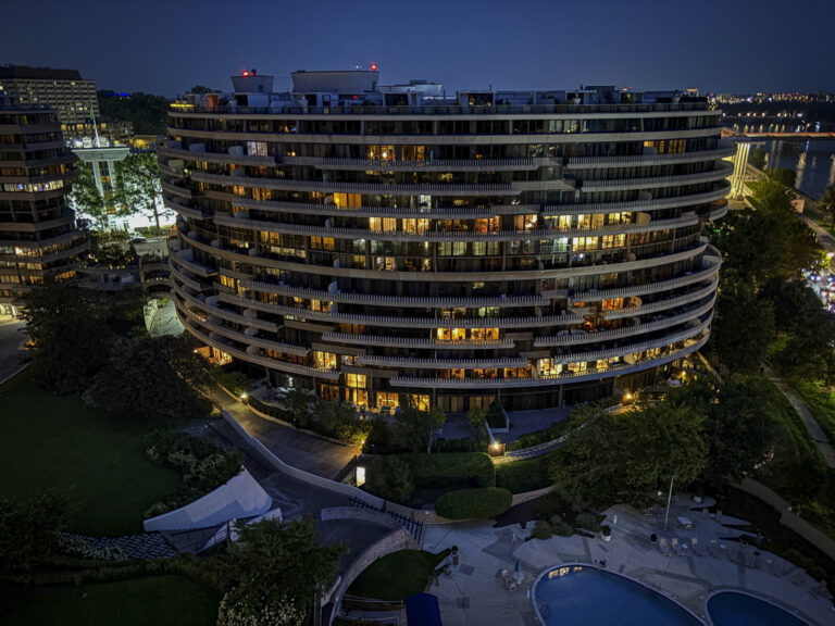 United States, Washington, 2026-08-12. The Watergate complex lit up at night, above the Potomac. Photograph by Fred MARI