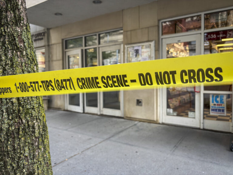 United States, New York, 2026-08-07. Police tape reading Crime Scene Do Not Cross stretched across a Manhattan sidewalk.