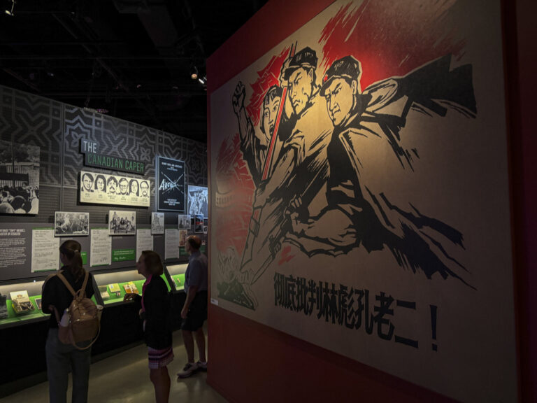 United States, Washington, 2026-08-12. A Chinese propaganda poster facing the display on the Canadian Caper, the 1980 ex