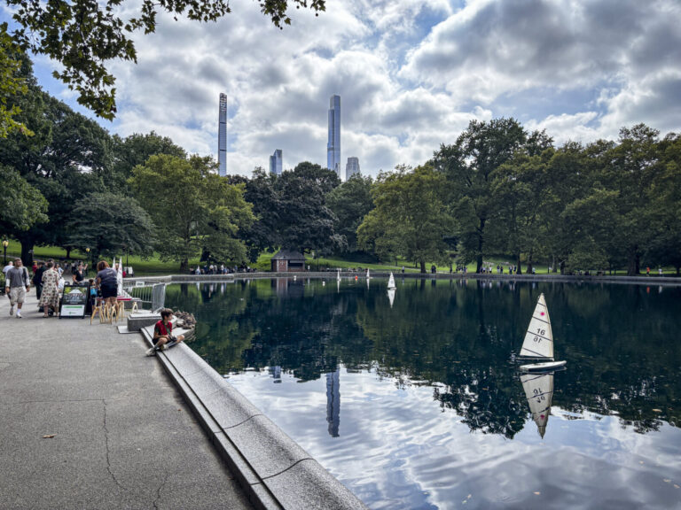 United States, New York, 2026-08-17. A child watches the model sailing boats on the Conservatory Water. Photograph by Fr