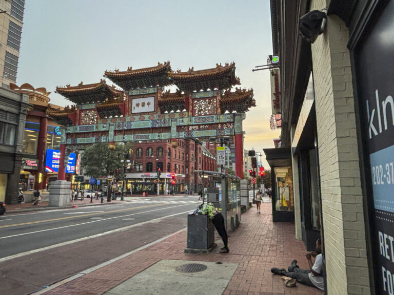 United States, Washington, 2026-08-10. The Friendship Archway of Chinatown at dusk, above H Street. Photograph by Fred M