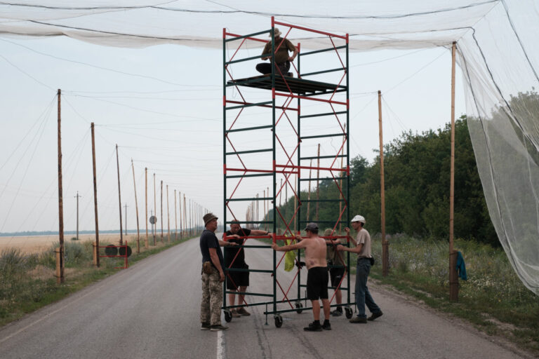 Ukraine, Dobropillia, 2025-07-12. In the Donbas, Ukrainian soldiers are installing fishing nets along several kilometers