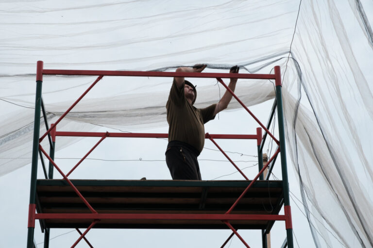 Ukraine, Dobropillia, 2025-07-12. In the Donbas, Ukrainian soldiers are installing fishing nets along several kilometers