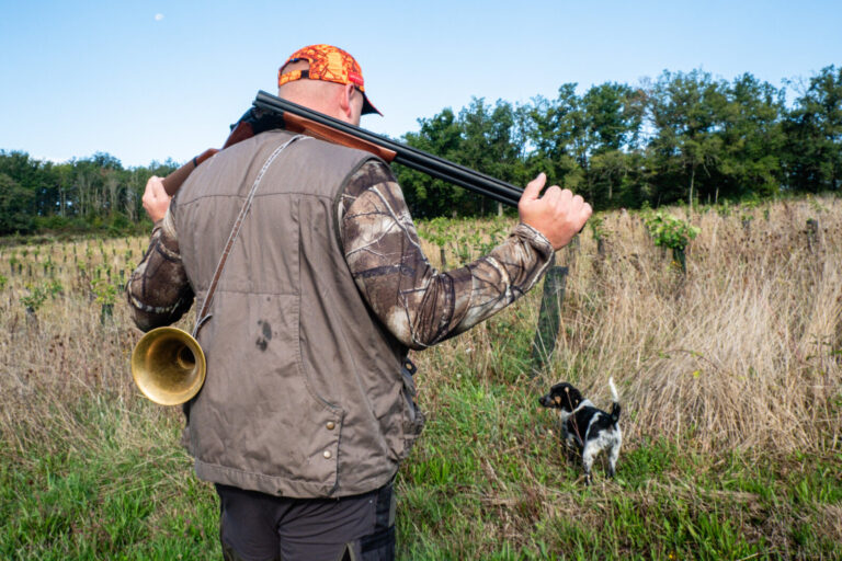 France, Le Breuil, 2025-09-11. A hunter with his rifle walks with his dog. Photography by Franck CHAPOLARD / Collectif D