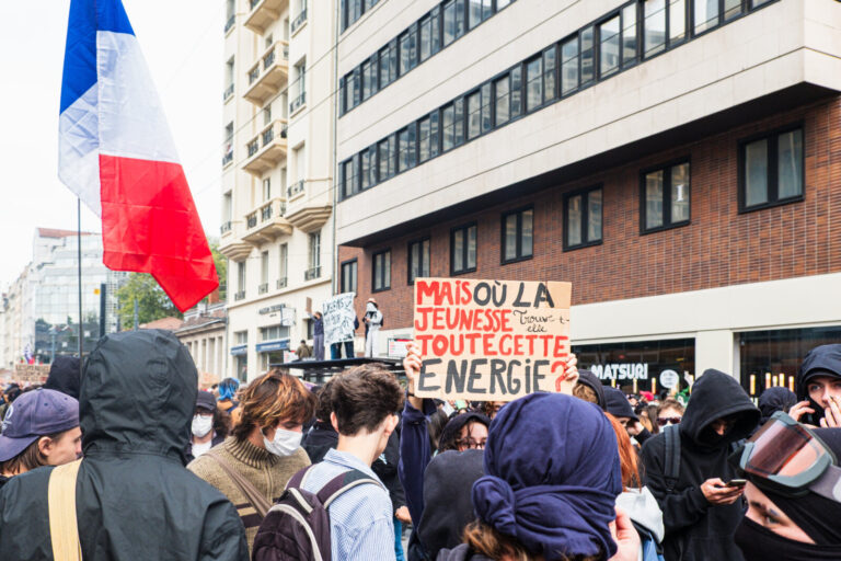 France, Lyon, 2026-10-13. Act V of the secondary school pupils' demonstrations, with a placard and the French flag in th