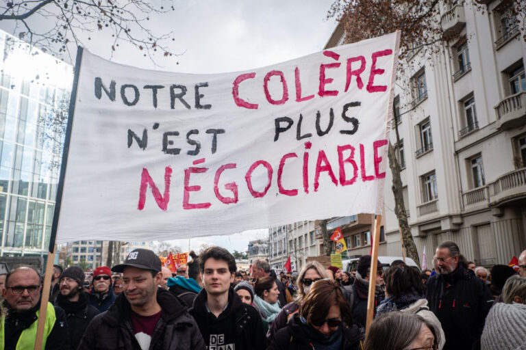 France, Lyon, 2023-01-31. Demonstration against the government's pension reform. Demonstrators in the cortege with a lar