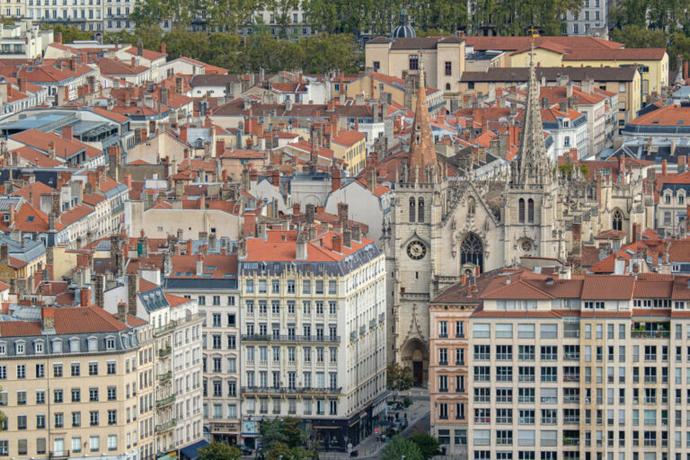 France, Lyon, 2023-10-16. View of the church of Saint Nizier amidst the buildings and roofs of the city. Photograph by F
