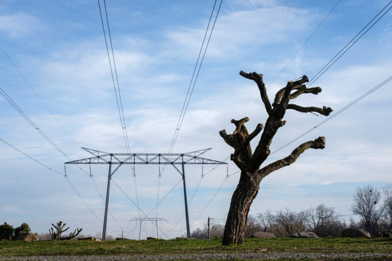 France, Civrieux d Azergues, 2024-01-30. High voltage pylons with their electric wires against a blue sky background and