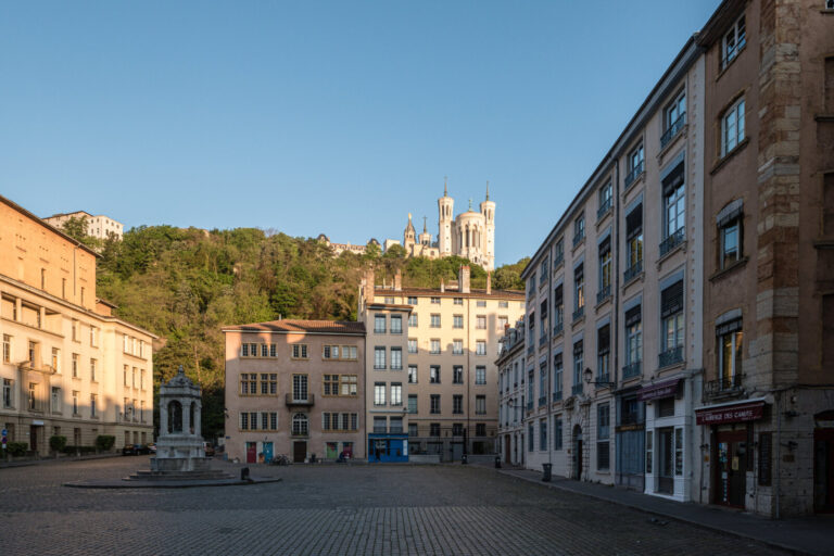 France, Lyon, 2023-05-03. Place st jean in the Vieux Lyon with its buildings and above the basilica of Fourviere. Photog