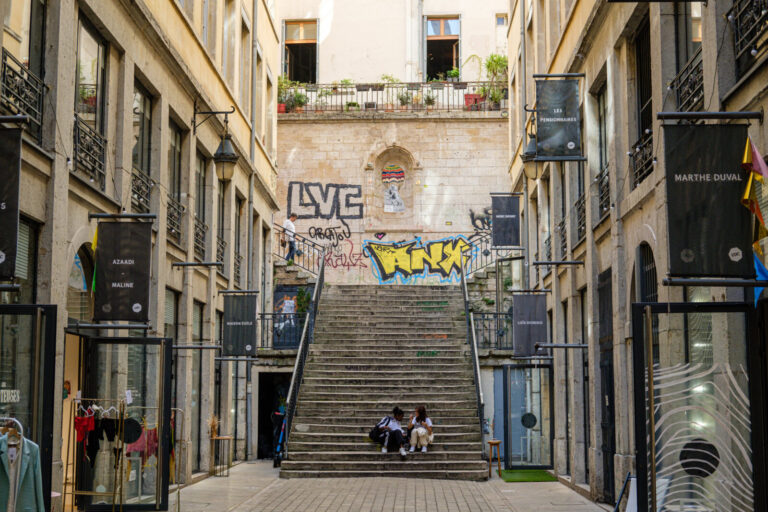 France, Lyon, 2023-09-27. Passage Thiaffait at the croix rousse with a central staircase and its fashion design shops. P
