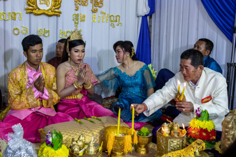 Cambodia, Phom Penh, Tuol Kok, 2019-11-29. A religious wedding ceremony takes place near the railway. Photography by Guy