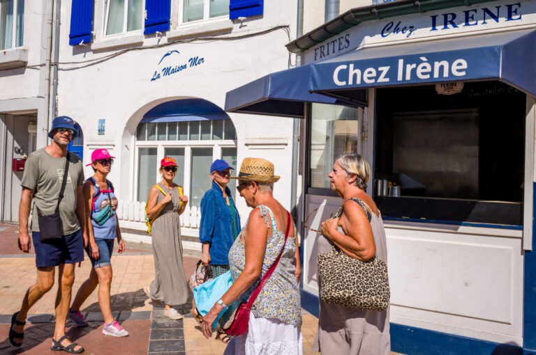 France, Bray-Dunes, 2026-08-12. France, Bray-Dunes, 12 August 2026. Seaside houses and chip shops line the beach, flanke