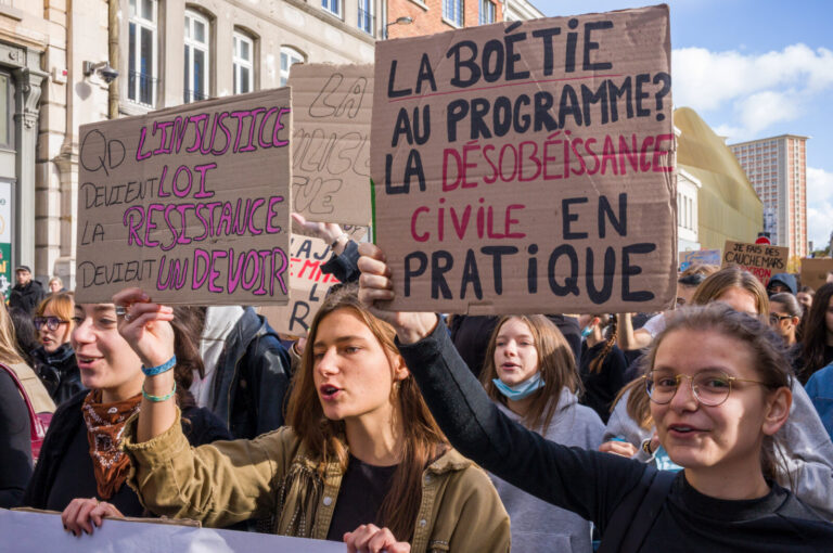 France, Lille, 2026-10-17. Protesters raise cardboard signs referring to La Boetie, civil disobedience and resistance ab