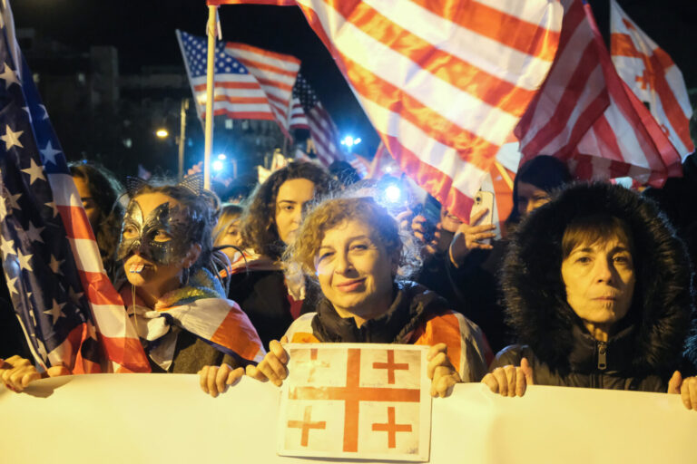 Georgia, Tbilisi, 2025-03-22. Protesters are carrying flags of Georgia and the USA. Protest in support of the Megobari A