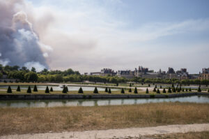 France, Fontainebleau, 2026-07-13. A large plume of smoke rises above Fontainebleau as a major wildfire spreads through