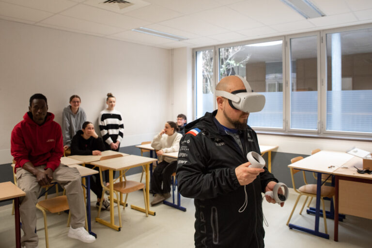 France, Brest, 2024-04-19. Brest, France, April 2024 - A mechanics teacher tries with his students a virtual reality mas