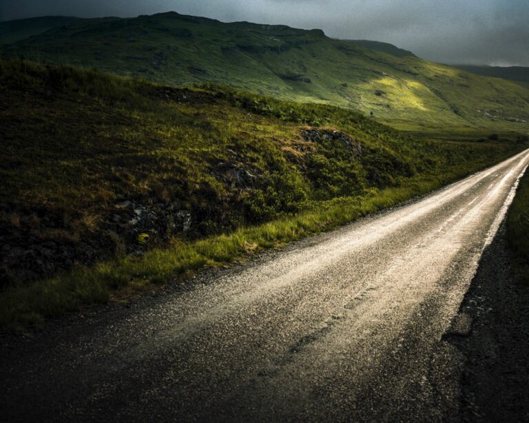 Scotland, Highlands, 2017-06. A small straight road through the typical Highland landscape. Photograph by Pierre Ollier 