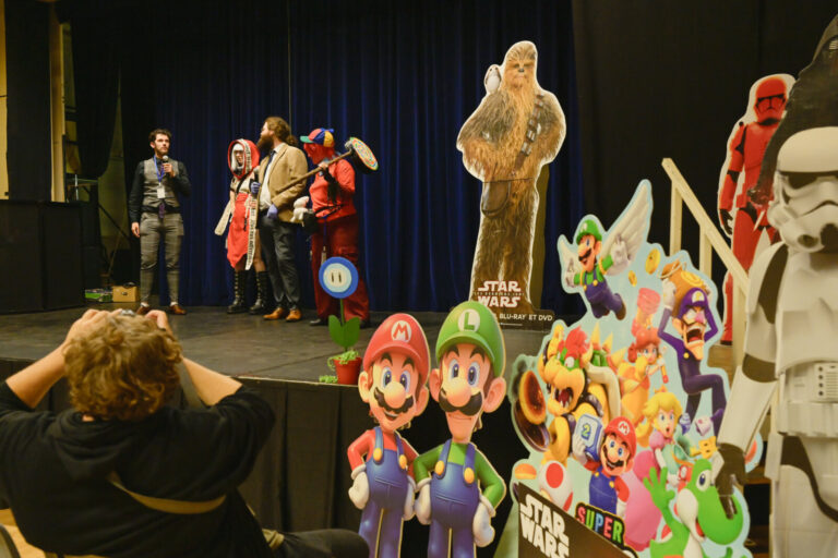 France, Digoin, 2025-09-13. Presentation of the jury for the cosplay competition, on a stage decorated with numerous pos