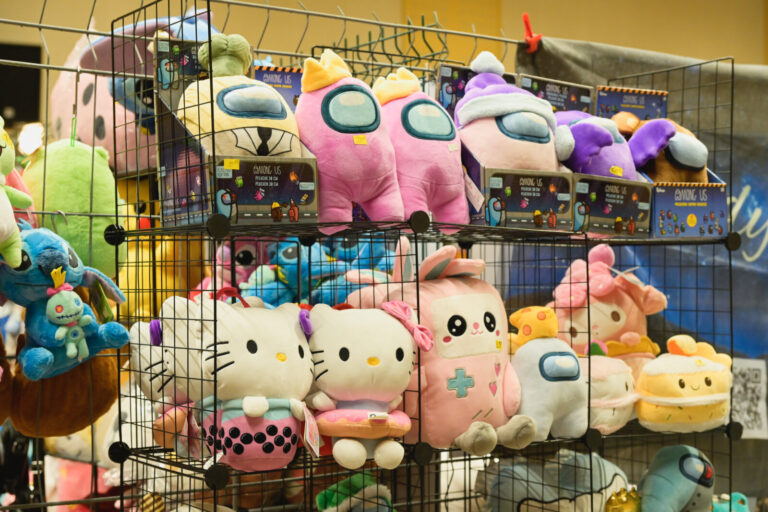 France, Digoin, 2025-09-14. Hello Kitty and Among Us soft toys, on display at a stand during the first Digoin Geek Unive