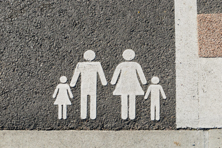 France, Paray-le-Monial, 2023-02-14. Logo of the parking space reserved for a family, with the white silhouette of a cou